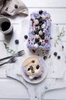 Vegan blueberry Swiss roll with chocolate and almonds — Stock Photo