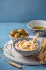 Homemade tarama salata with bread sticks and olives — Stock Photo
