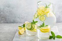 Refreshing lemonade with cucumber in a pitcher — Stock Photo
