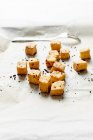 Still life of oven fried tofu and spices — Stock Photo