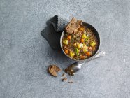 Lentil stew with potatoes and carrots served with bread — Stock Photo