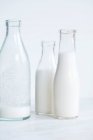 Almond milk in glass bottles — Stock Photo