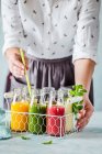 Various smoothies in a drinks holder — Stock Photo
