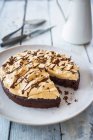 Chocolate peanut cake, sliced — Stock Photo