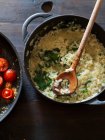 Risotto with herbs and fried cherry tomatoes — Stock Photo