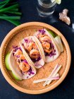 Asian flavored shrimp tacos with red cabbage and green apple slaw — Stock Photo