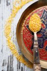 A spoonful of couscous on an oriental plate (seen from above) — Stock Photo