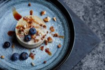 A nut torte with blueberries — Stock Photo