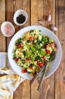 Salad with couscous, olives, tomatoes, cucumber and feta cheese — Stock Photo