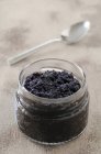 Black caviar in a glass — Stock Photo