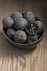 Loomi (dried limes, Middle East) in a small bowl — Stock Photo