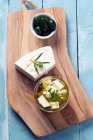 Feta cheese, olives and marinated feta in olive oil — Stock Photo