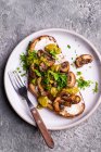 Toast with garlic cheese mushrooms green pesto and parsley — Stock Photo