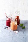 Three different smoothies with blood orange, raspberries, beetroot and tomato — Stock Photo