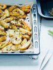 Baked potatoes with lemon and rosemary — Stock Photo