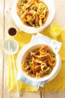 Fried noodles with chicken breast, carrot and ginger — Stock Photo
