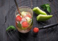 Fizzy white wine Sangria with watermelon and melon balls — Stock Photo