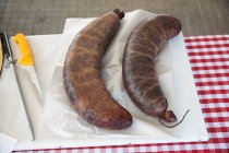 Two Biraldo blood sausages on kitchen board — Stock Photo
