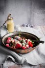 Frozen berries witha creme anglaise sauce, dairy free — Stock Photo