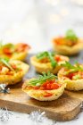 Bruschetta with fresh vegetables and herbs on wooden background — Stock Photo