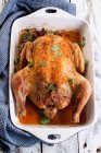 Roast chicken in a dish — Stock Photo