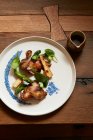 Pigeon with green asparagus and root parsley — Stock Photo