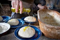 Homemade bread dough drizzled with oil (camping) — Stock Photo