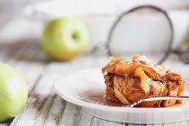 Apple French toast casserole with maple syrup and powdered sugar — Stock Photo