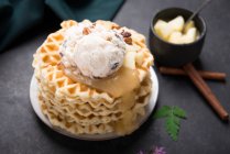 Waffles with vanilla and pecan nut ice cream, apple sauce and apple compote — Stock Photo