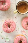 Pink doughnuts and coffee — Stock Photo