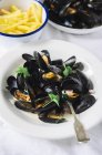 Mussels with french fries — Stock Photo
