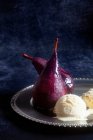 Red wine pears with vanilla ice cream — Stock Photo
