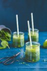 Green smoothies with spinach, lime and cress — Stock Photo