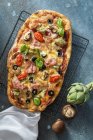 Pizza Capricciosa with artichokes, ham and mushrooms — Stock Photo