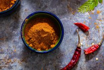 Cooking spices on table in kitchen — Stock Photo