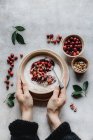 Yogurt with fresh cranberries and almonds — Stock Photo