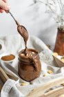 Drip of Homemade Vegan Gluten free Chocolate Hazelnut Spread with Cookies — Stock Photo