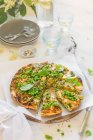 Asparagus and pea summer frittata with freah basil leaves — Stock Photo