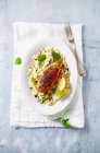 Spicy chicken breast on couscous with shallots and mint — Stock Photo