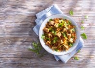 Fried tofu with yellow lentils and herbs — Stock Photo