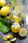 Lemons being soaked in salt — стокове фото