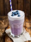 Vegan layered blueberry smoothie with coconut cream — Stock Photo