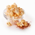 Popcorn with paprika powder — Stock Photo