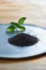 Black sesame seeds in a glass jar. — Stock Photo
