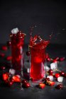 Strawberry, rhubarb and cherry drink with ice — Stock Photo