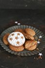 Gluten-free homemade gingerbread decorated with stars and icing sugar on a tin plate — Stock Photo