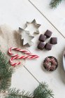 Gingerbread cookies, dominoes and candy canes — Stock Photo