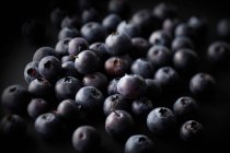 Pile of blueberries with dark shadows — Stock Photo