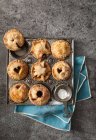 Small mince pies in a vintage baking tray (seen from above) — Stock Photo