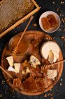 Cheese board with ricotta, camembert, blue cheese, nuts and honey — Stock Photo